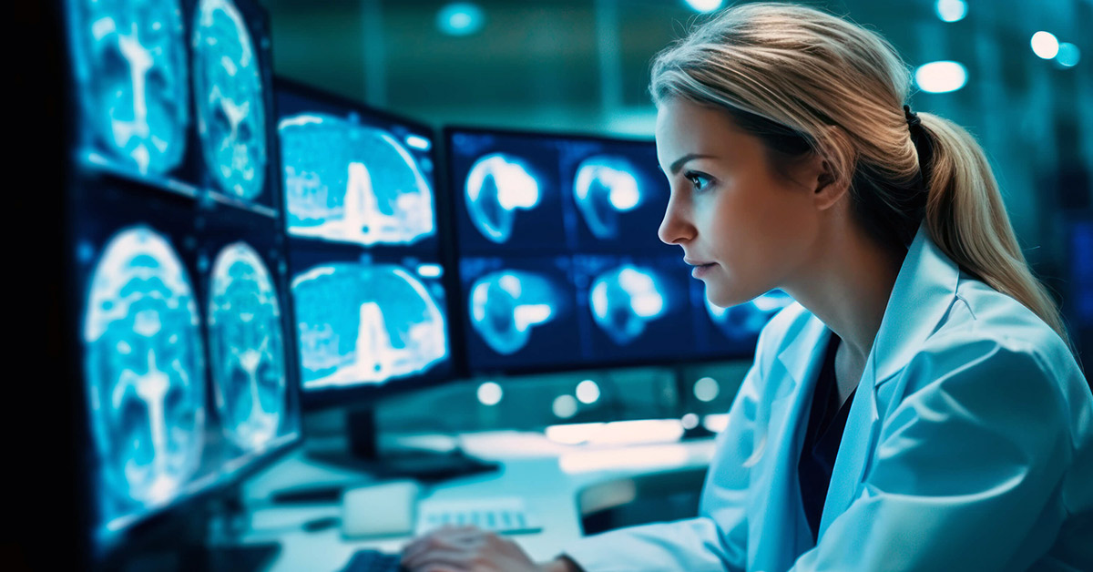 A female clinician carefully reviews AI-assisted medical imaging scans on multiple monitors in a high-tech hospital setting.